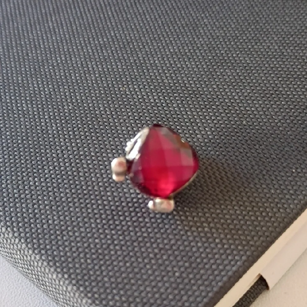 Pandora Disney Mickey Mouse Heart charm featuring a fuchsia crystal.